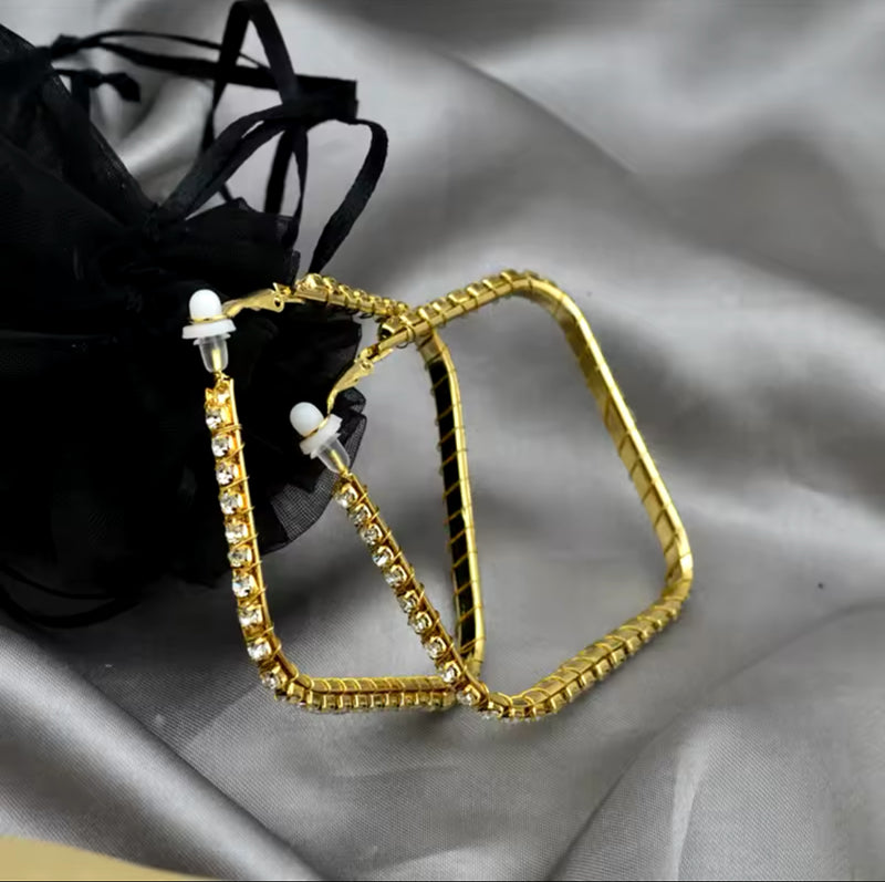 Vintage clip on 1" gold, black and white swirl button style earrings