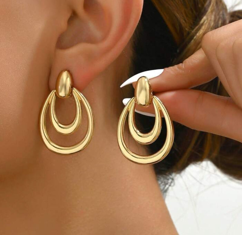 Pierced 1 1/2" shiny gold cutout teardrop dangle earrings