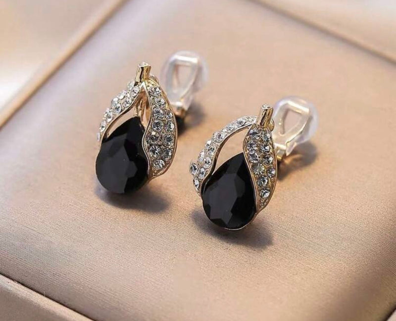 Clip on 1" gold, black and clear stone cutout teardrop earrings
