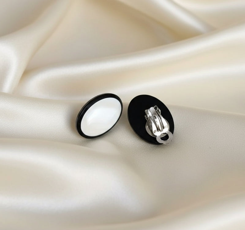 Clip on 1" silver, black and iridescent white shell oval button style earrings