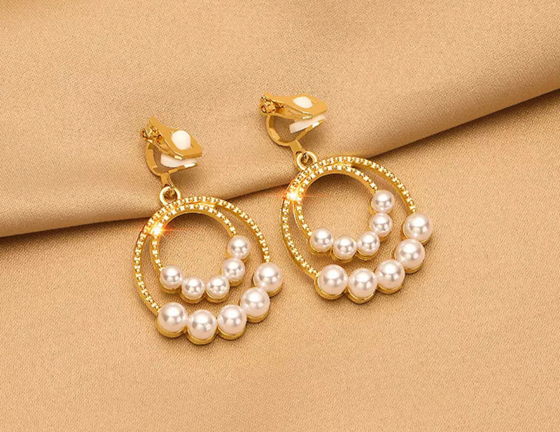 Classy clip on1 1/2" gold textured double row white pearl dangle earring
