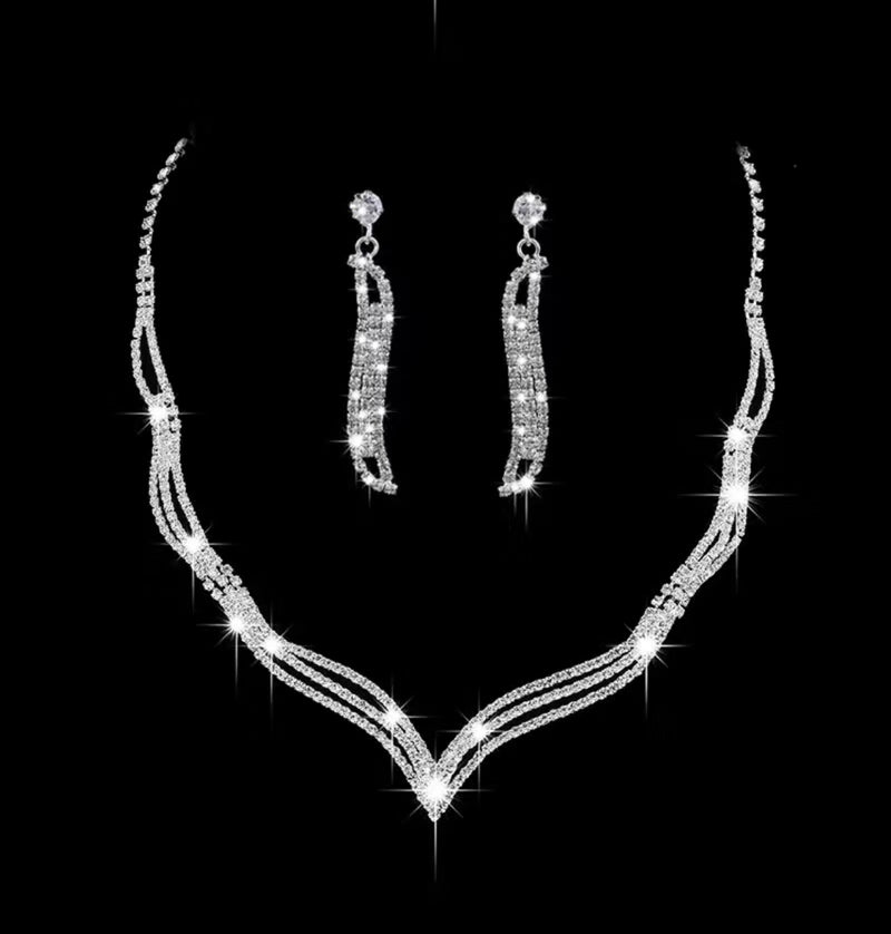Pierced silver & clear stone wavy pointed necklace and earring set