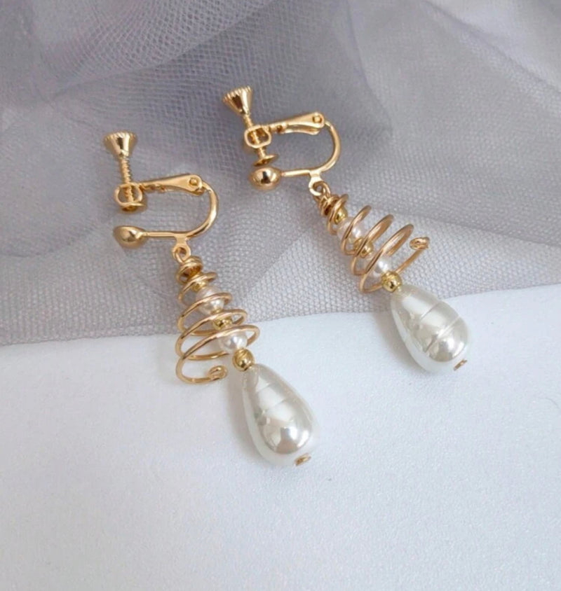 Clip on 1 3/4" gold spiral wire and white pearl dangle earrings