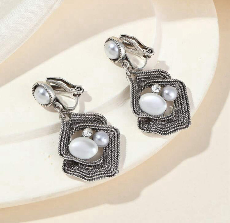Clip on 1 1/2" silver, white pearl & stone dangle wavy earrings