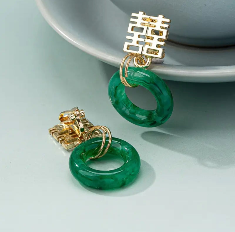 Clip on 1 1/2" gold cutout square top earrings with green dangle hoop