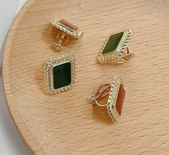 Clip on 3/4" gold and green square stone earrings with twisted edges