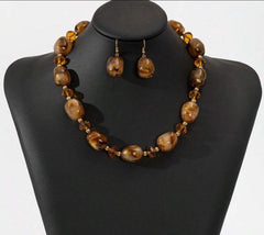 Pierced gold and brown sparkle bead necklace and earring set