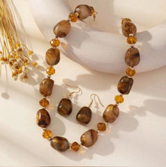 Pierced gold and brown sparkle bead necklace and earring set