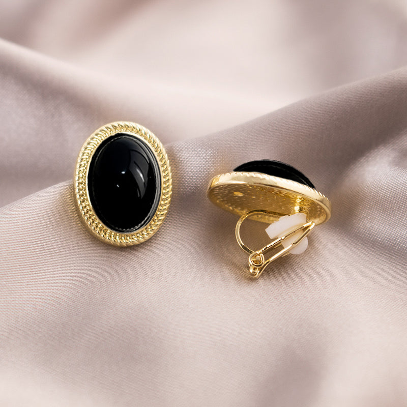 Clip on 3/4" gold and black stone oval button style earrings