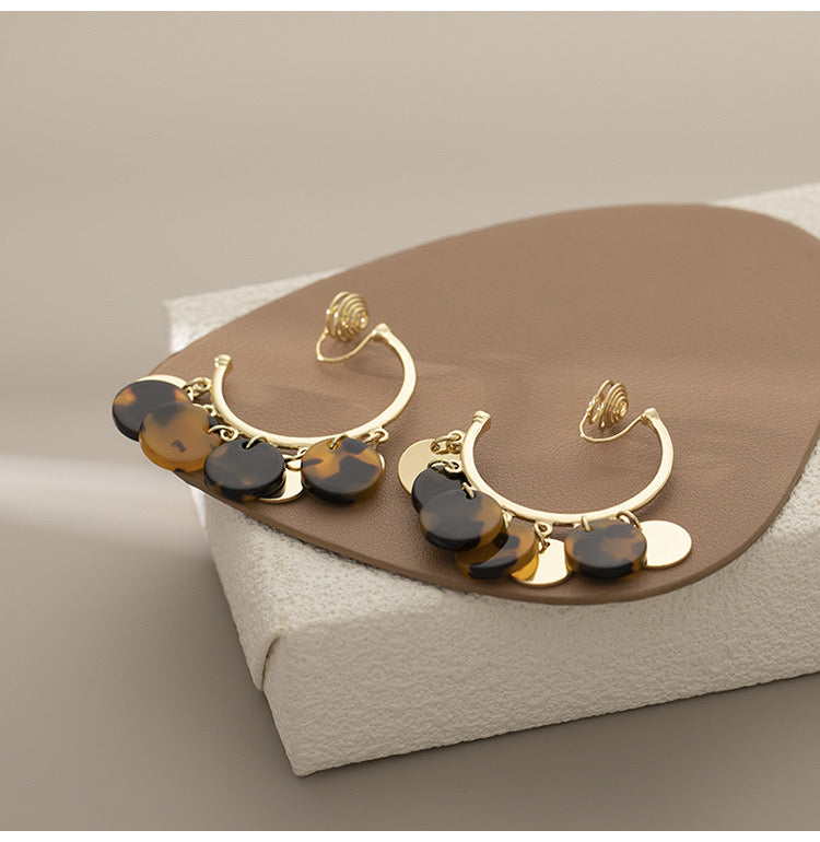 Clip on 2" gold comfort fit coil hoop earrings with brown dangle circles