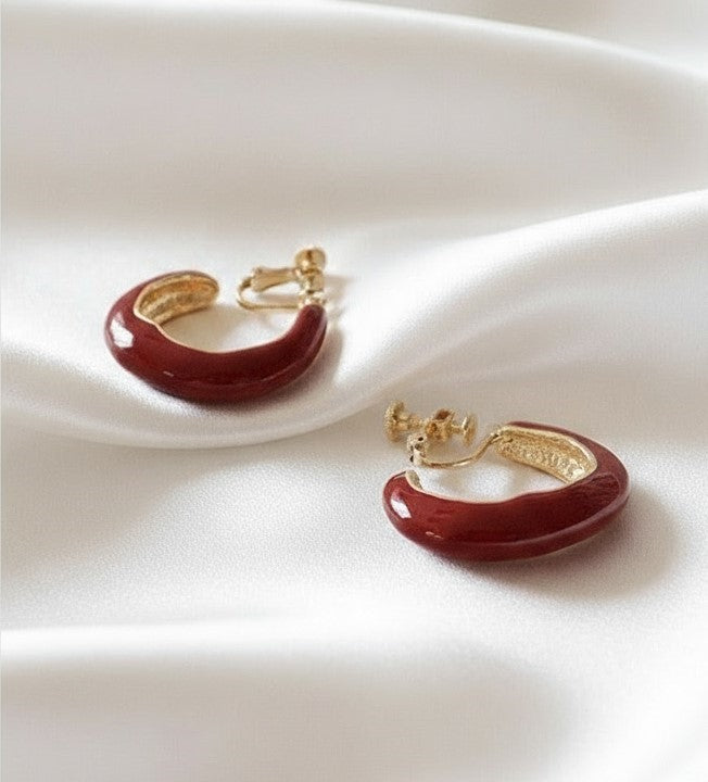 Clip on 1 1/4" gold and burgundy wavy open back hoop earrings