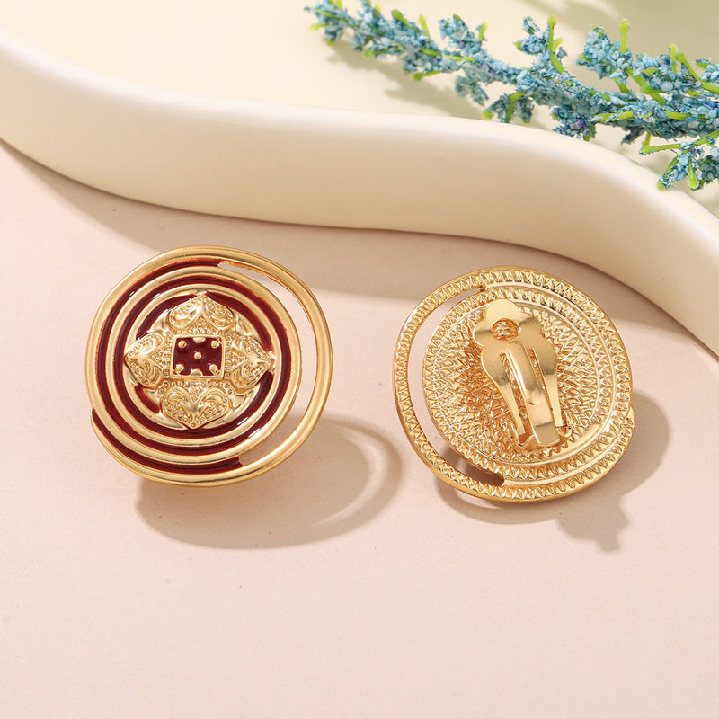 Clip on 1 1/4" gold, red and green indented cutout circle earrings