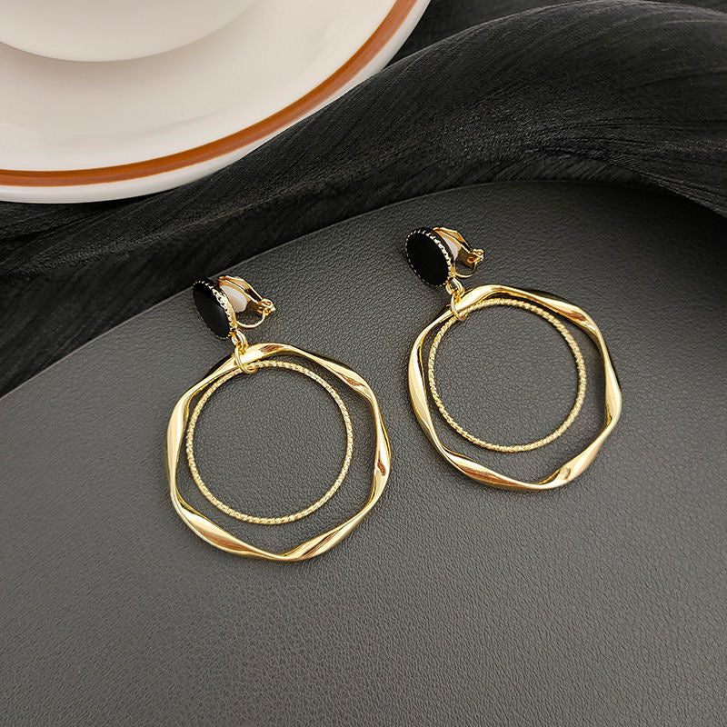 Clip on 2 1/2" black and gold twisted multi hoop earrings