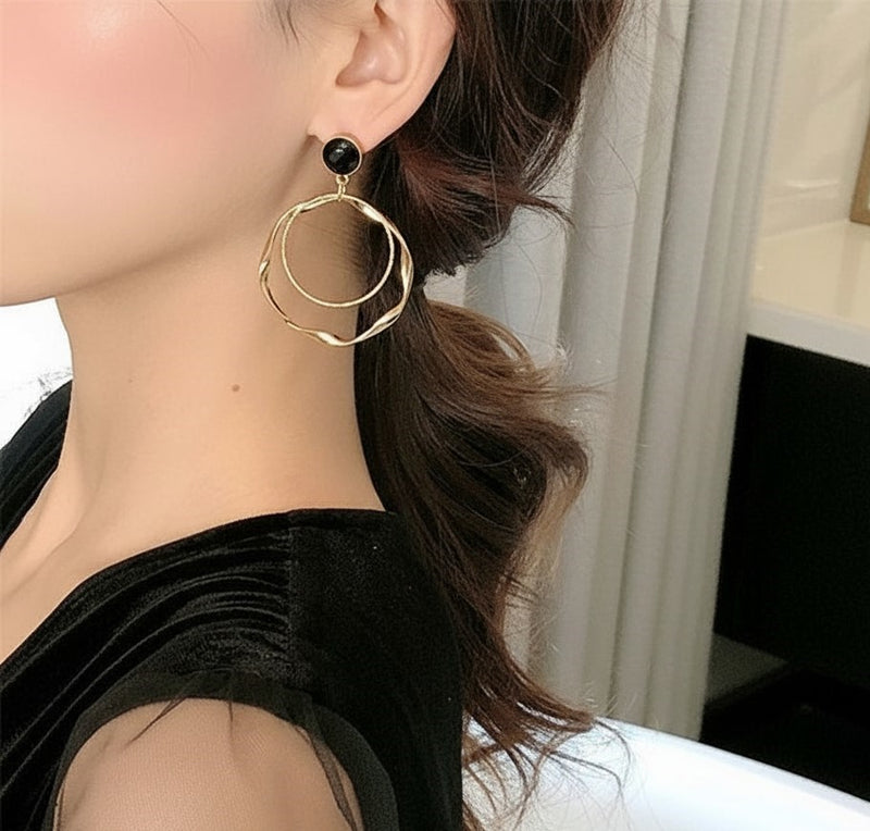 Clip on 2 1/2" black and gold twisted multi hoop earrings