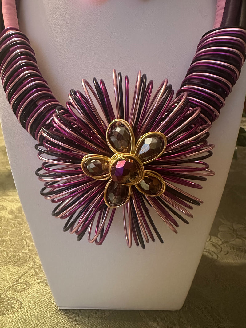 Clip on gold, purple multi colored wire flower necklace and earring set