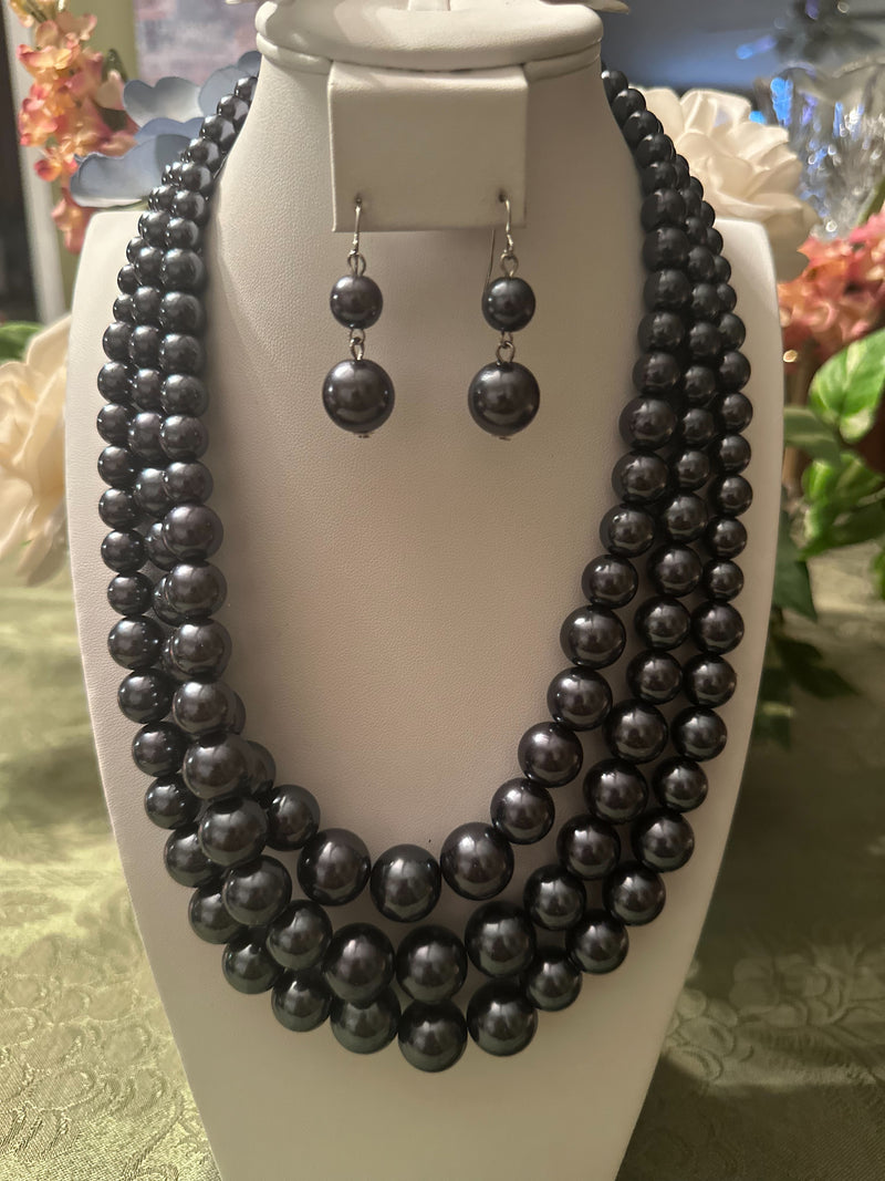 Pierced silver and gray bead three strand necklace and earring set