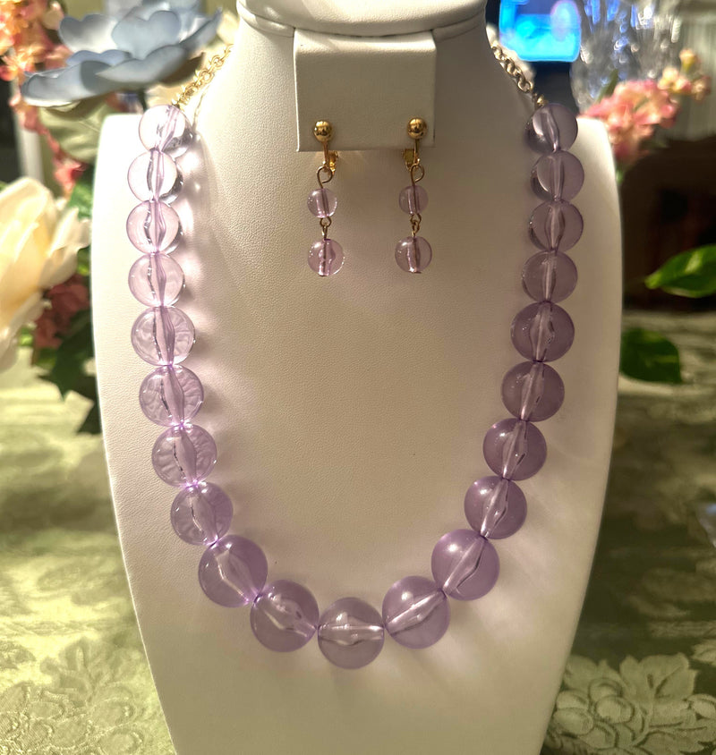 Clip on gold and clear large purple bead necklace and earring set
