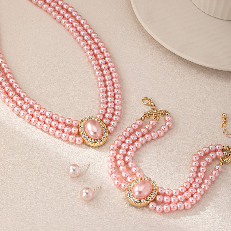 3Pc Pierced gold and pink pearl choker necklace, bracelet and earring set