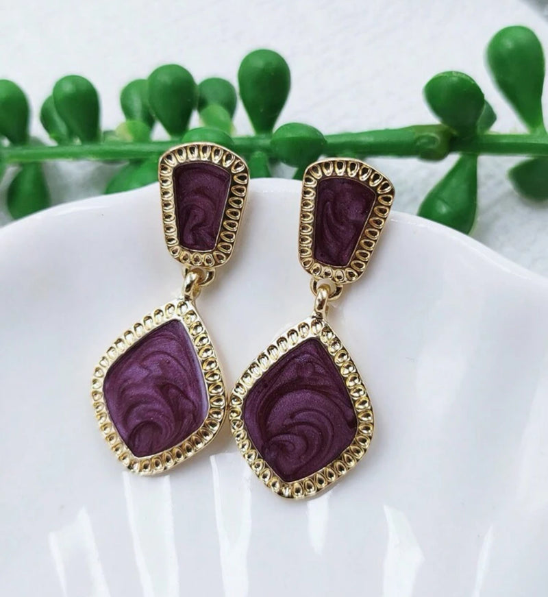 Clip on 1 1/2" gold and purple cream dangle earrings