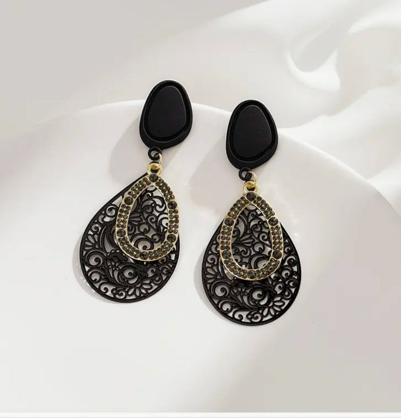 Clip on 2 3/4" comfort fit black and gold cutout teardrop earrings