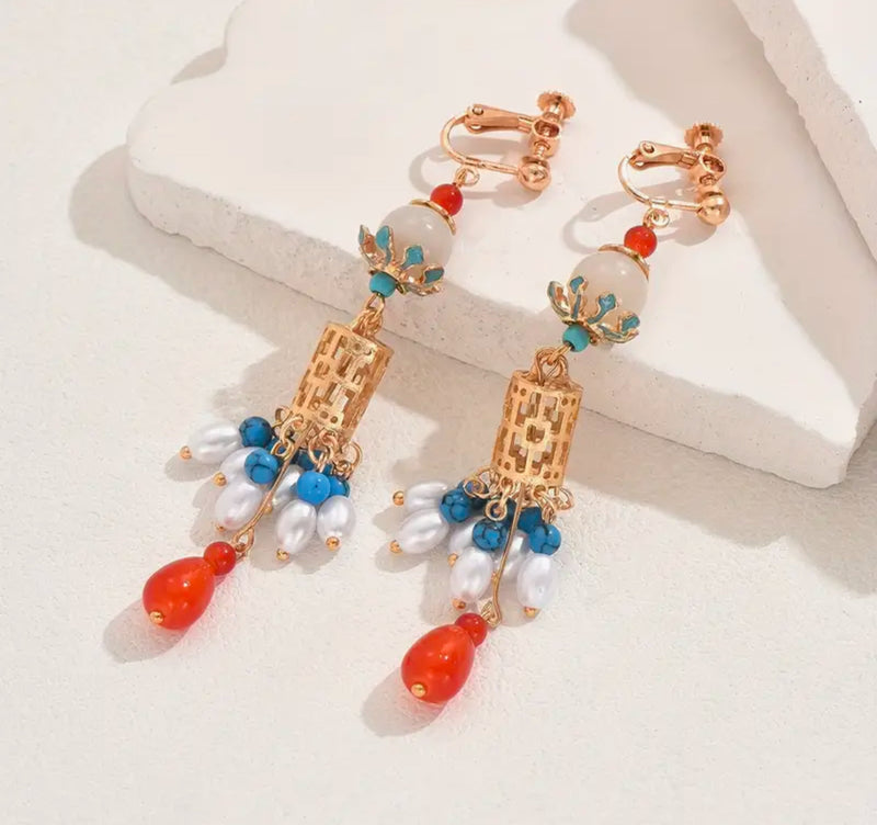 Clip on 3 1/2" long gold, turquoise, multi colored beads and pearl earrings