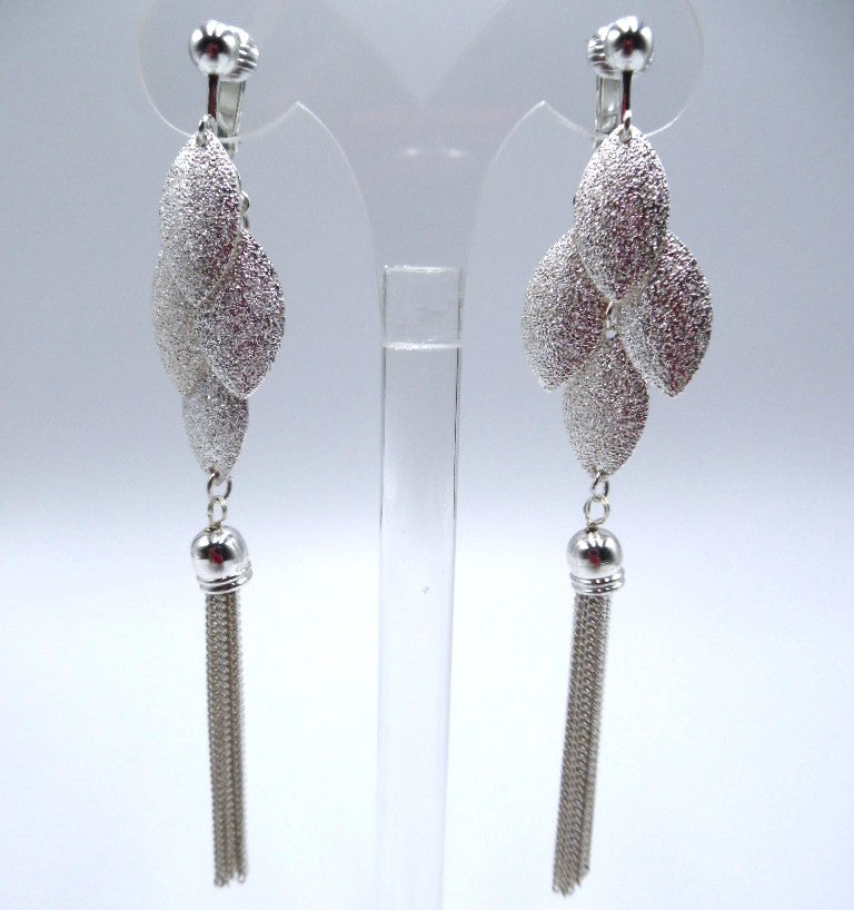 Clip on 4 1/4" long silver and clear stone graduated chain earrings