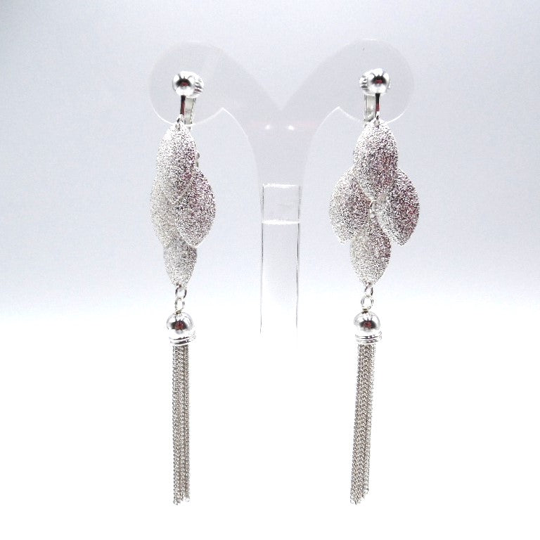 Clip on 4 1/4" silver chain tassel textured leaf dangle earrings