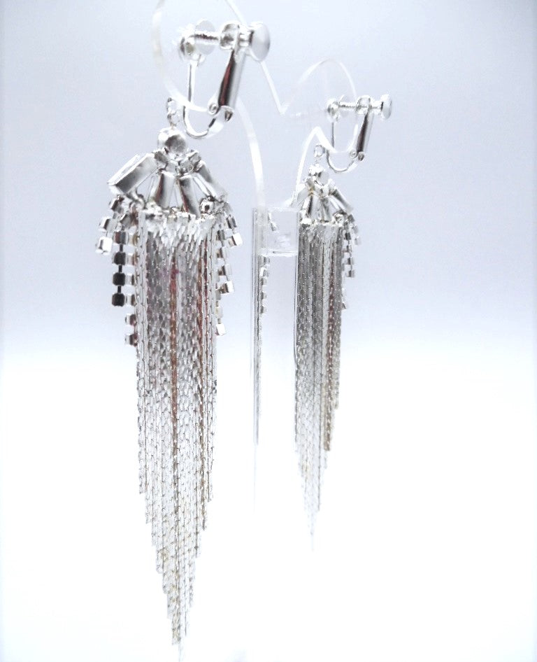 Clip on 4 1/4" long silver and clear stone graduated chain earrings