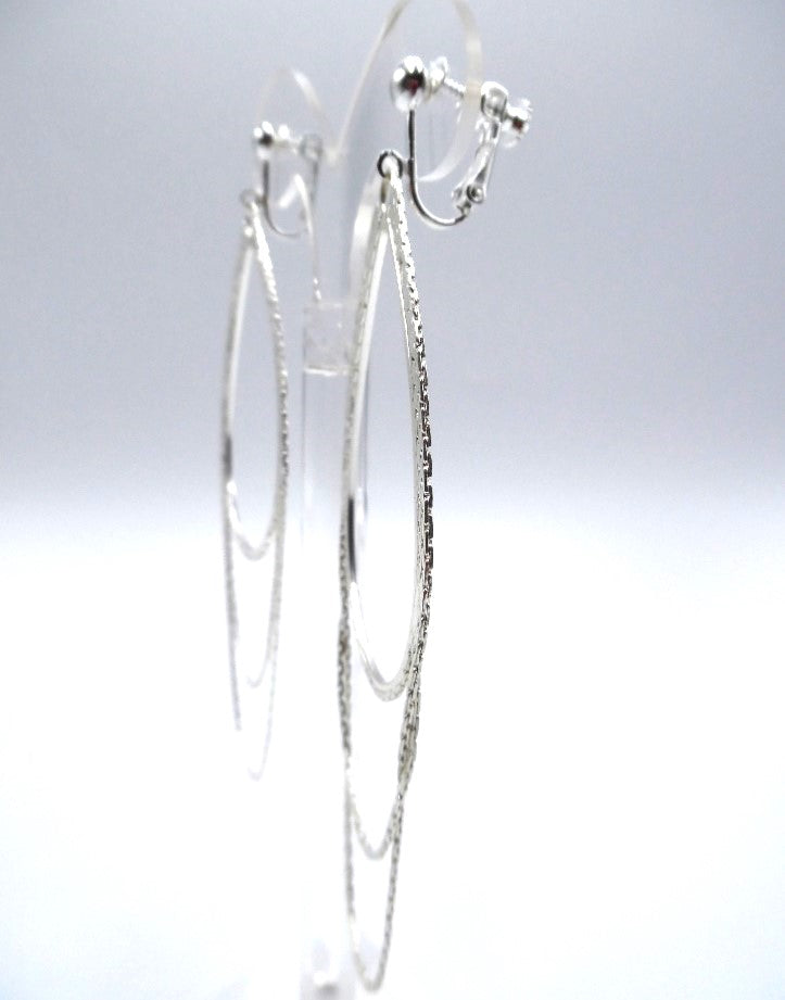 Clip on 4 1/4" shiny silver layered loop chain dangle earrings
