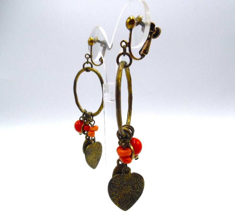 Clip on 3 1/4" brass hoop heart earrings with dangle orange beads