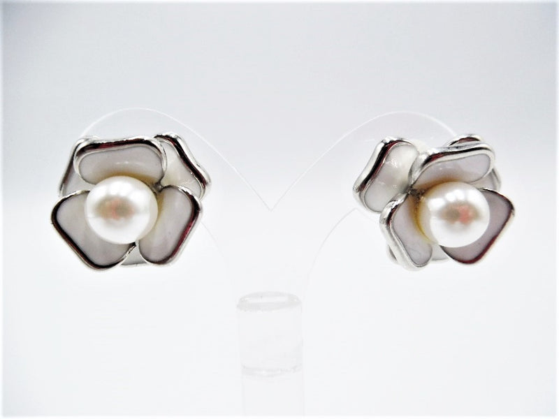 Clip on 3/4" silver and white flower earrings with a center pearl