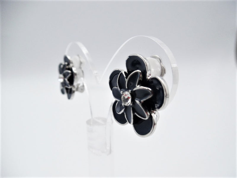 Clip on 3/4" silver and black flower button style earrings w/clear stone