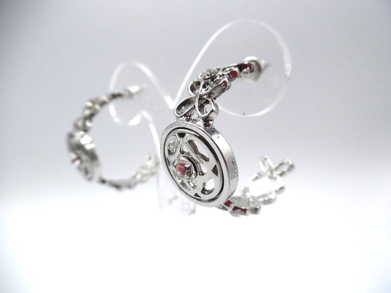 Pierced silver flower and clear stone open back hoop earrings