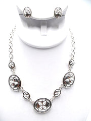 Pierced silver chain cutout oval piece necklace and earring set