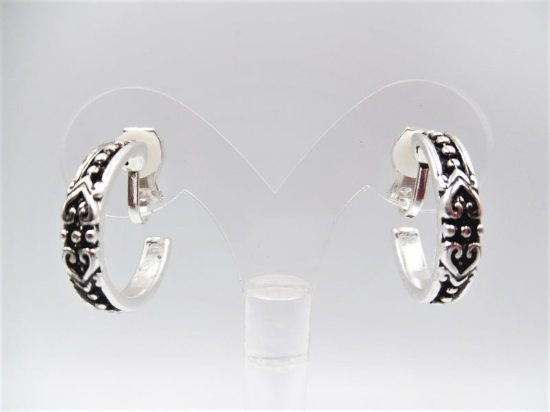 Clip on 1" silver and black raised dot open back hoop earrings