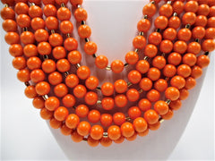 Clip on gold and orange 6 layer orange necklace and earring set