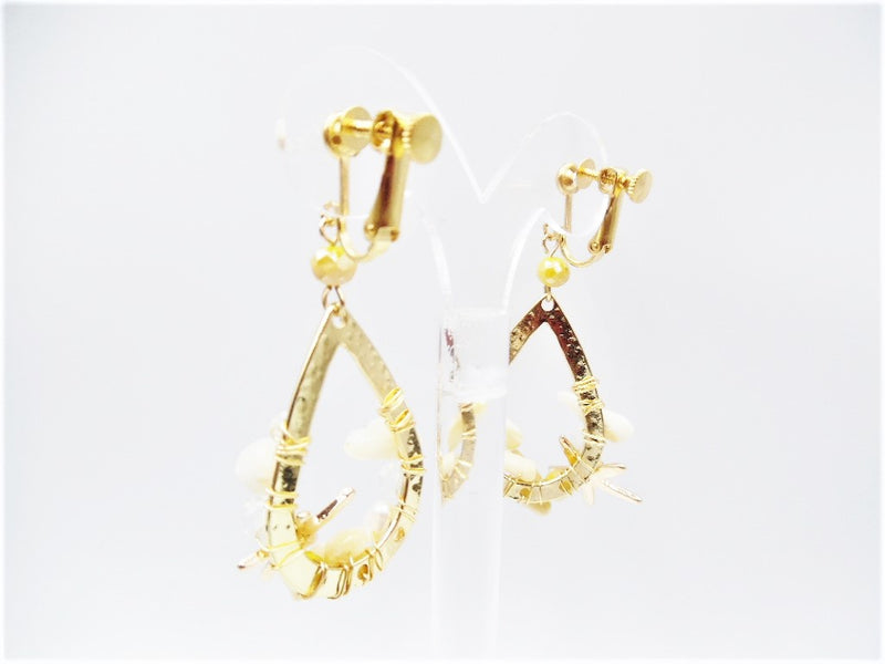Clip on 2 1/2" gold teardrop starfish earrings with cream bead earrings