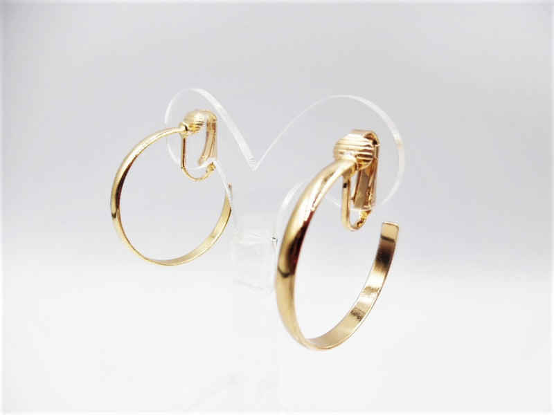 Clip on 1 1/4" shiny gold open back hoop earrings