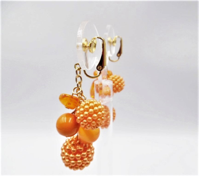 Clip on 2 1/2" gold and orange odd shaped cluster dangle bead earrings