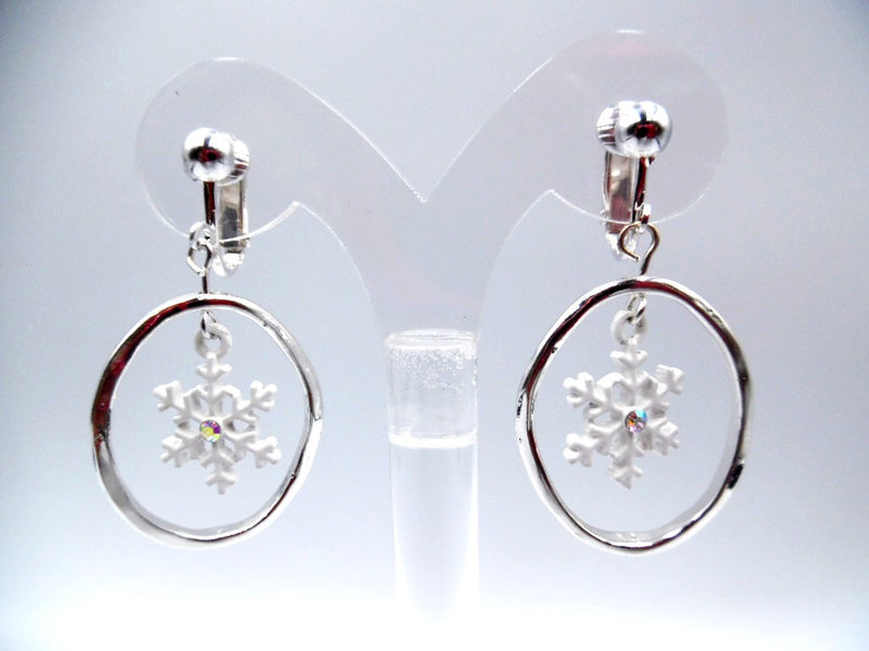 Clip on 1 3/4" silver hammered hoop earrings w/white snowflake