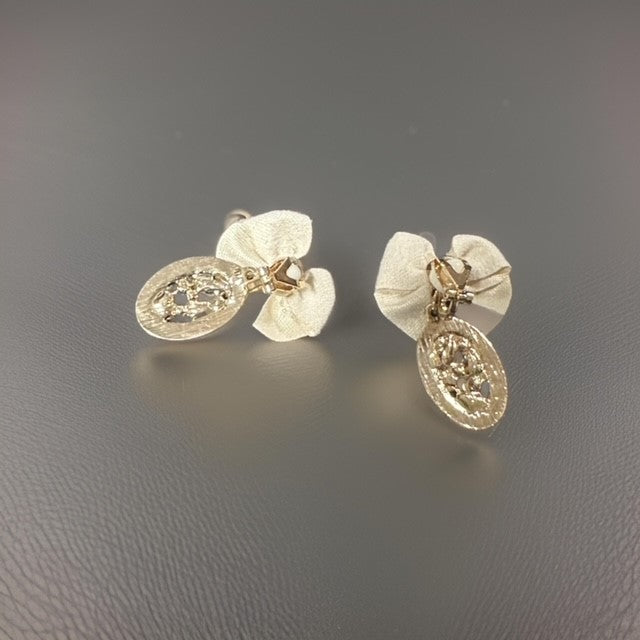 Clip on 1 1/2" gold, tan bow, and pearl edge dangle earrings