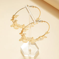 DSN Pierced gold hoop earrings with bottom butterflies