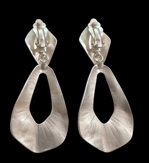 Clip on 3 1/2" large matte silver hammered cutout odd shaped earrings