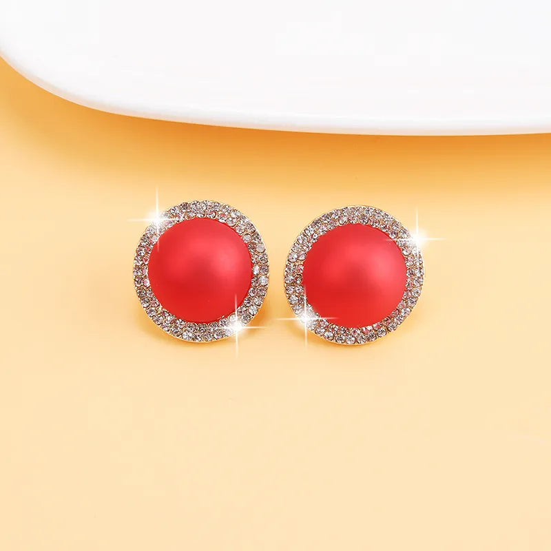 Trendy clip on 1" gold round red stone earrings with clear stone edges