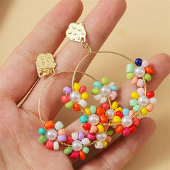 Pierced gold wire hoop earrings with multi colored or yellow beads & pearl