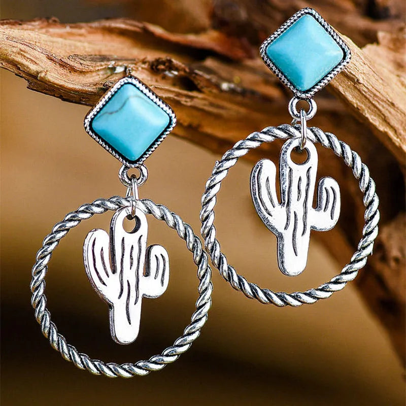 Pierced silver and turquoise dangle hoop earrings with center cactus