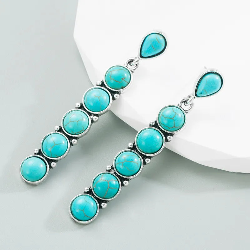 Pierced 2 3/4" silver and turquoise stone long dangle earrings