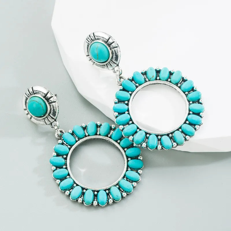 Western pierced 2 1/2" silver and oval turquoise stone hoop earrings