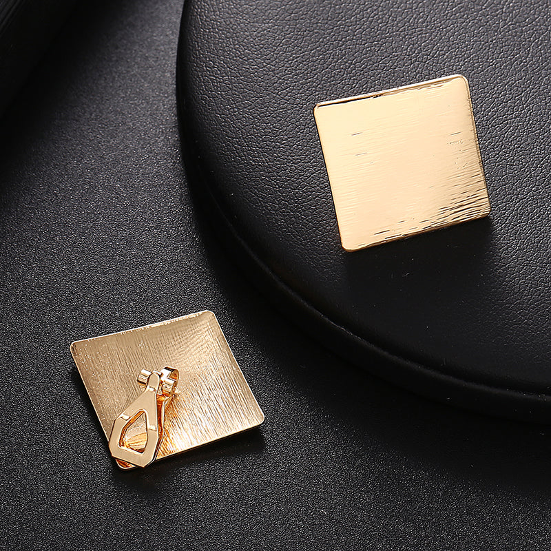 Clip on 1" gold textured square button style earrings