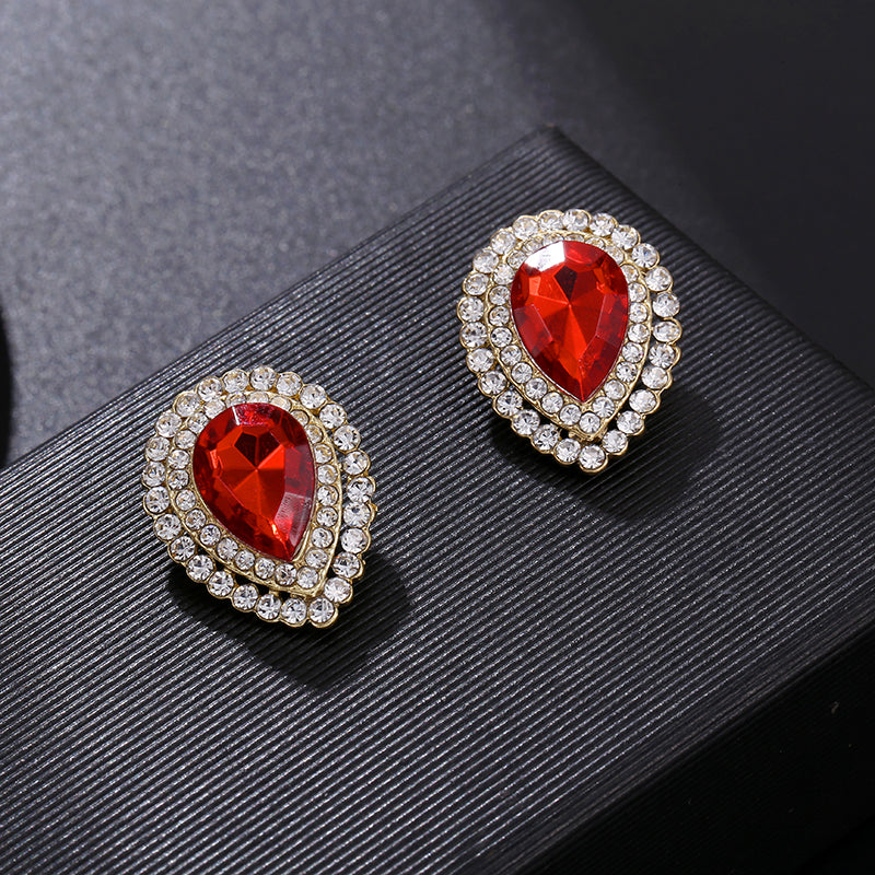 Clip on 1" gold, clear & red stone teardrop earrings